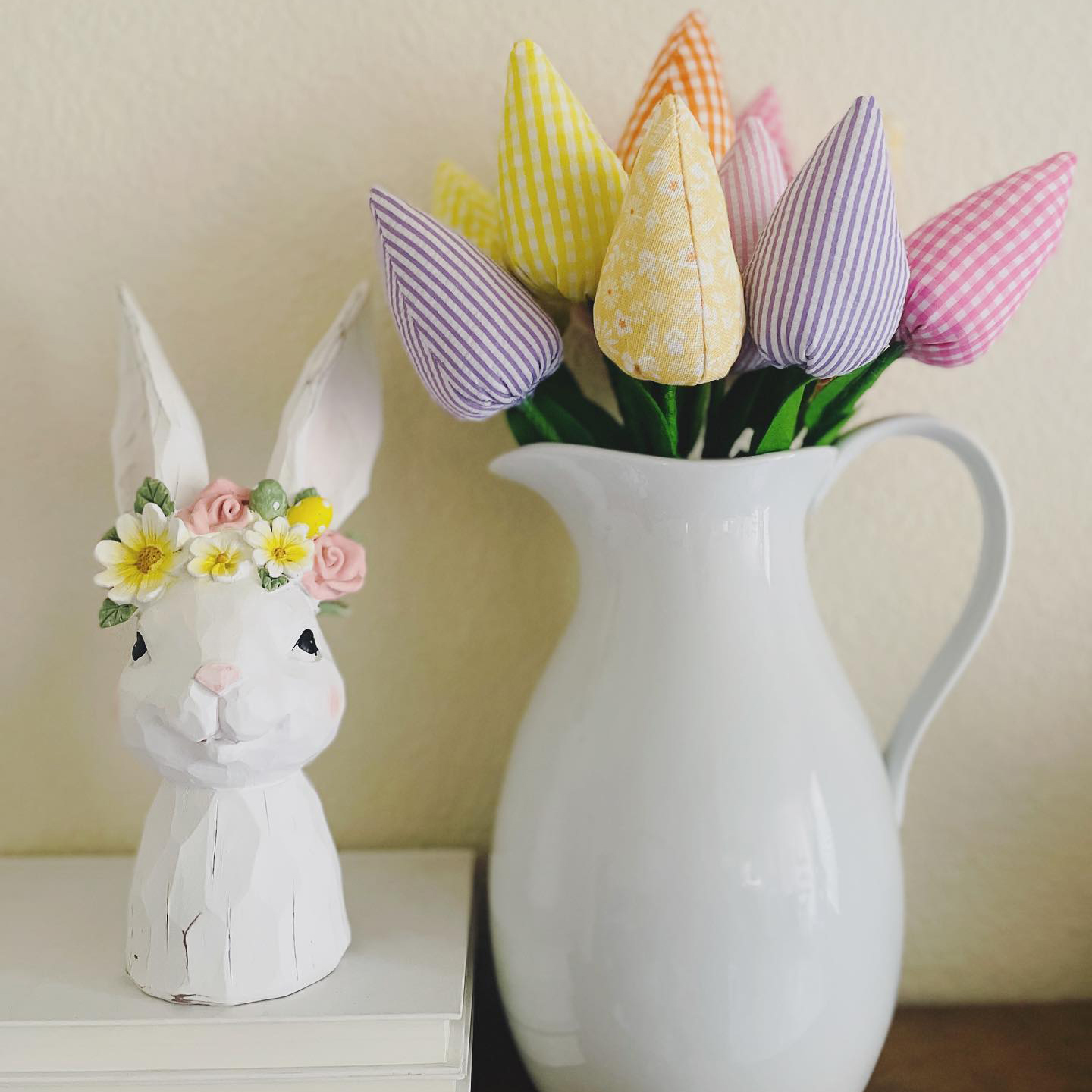 Low-cost cute Easter ceramic bunny and a white ceramic vase with Spring flowers from a Ross store