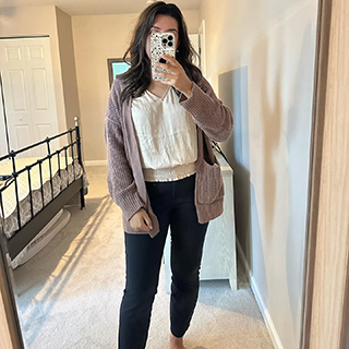 Stylish and affordable woman's fall outfit, beige cardigan, white blouse, and black trousers from a Ross store