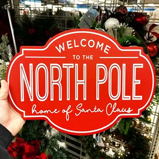 An image displaying festive Christmas Ross home décor: “welcome to the north pole”