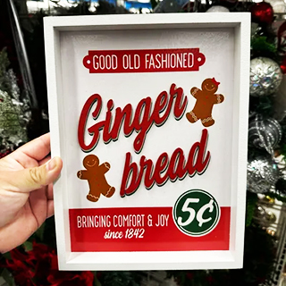 An image displaying a vintage looking Christmas red and white wall décor from a Ross store: “ginger bread”