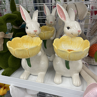 Ceramic bunnies holding a yellow flower bowl from Ross