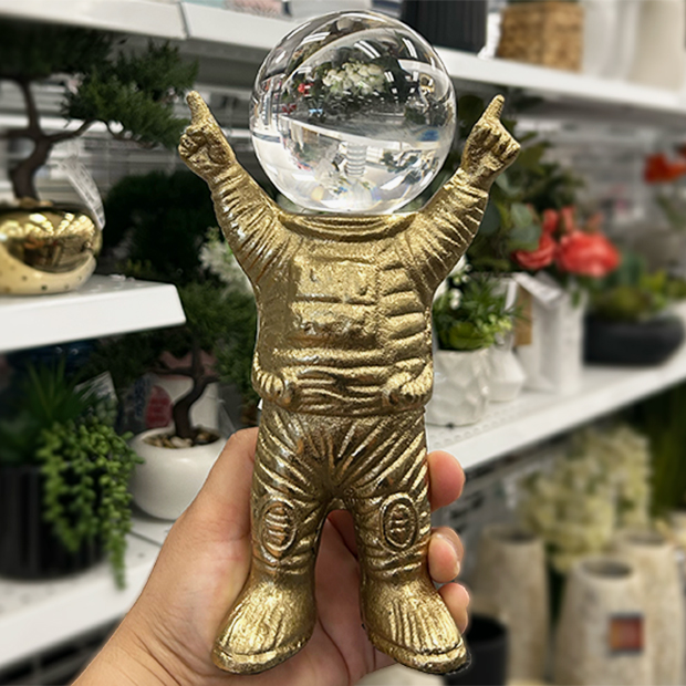 Gold small astronaut desk decor found in store at Ross.