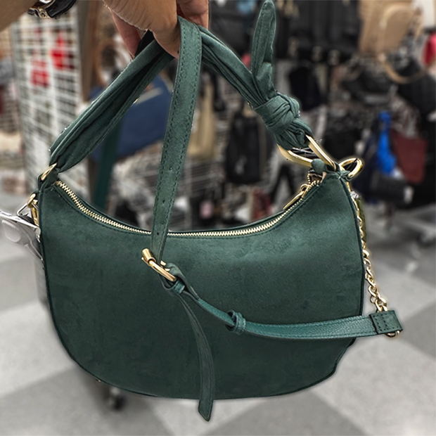Emerald green crescent shaped handbag with gold hardware.